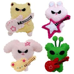 four small stuffed animals with different designs on them