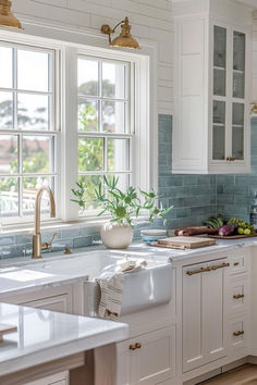 50 Amazing Farmhouse Kitchen Backsplash Designs You'll Love Backsplash Kitchen With Window, Beach Glass Kitchen Cabinets, Farmhouse Kitchen Blue Backsplash, Farmhouse Kitchen Backsplash Tile, Blue Tiled Kitchen, Bungalow Kitchens, White Gold Blue Kitchen, Kitchen Blue Backsplash Ideas, Seaglass Backsplash