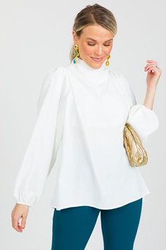 You cannot go wrong with a piece like this! It hangs perfectly without clinging with a draped high neckline. The woven fabric lends a dressier appeal, and it is lined through the bust so no special undergarments or layering required! Elegant Stretch Mock Neck Top For Fall, Versatile Long Sleeve Mock Neck Top, Chic Stretch High Neck Blouse, Chic Stretch Long Sleeve Top, Solid Color Long Sleeve Mock Neck Top For Work, Elegant Long Sleeve Mock Neck Top For Fall, Stretch Long Sleeve Top For Spring Workwear, Feminine Long Sleeve Stretch Blouse, Feminine Stretch Long Sleeve Blouse