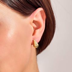 Add a touch of timeless elegance to your look with these Teardrop Earrings. These stunning earrings feature a classic teardrop design that enhances your natural beauty by offering a radiant shine that catches the light with every movement. Perfect for both casual and formal occasions, they are versatile enough to complement any outfit, from a simple day dress to an evening gown. - Made in 14k solid gold - Earring Width: 8.30 mm / 0.32 inches - Thickness: 9.05 mm / 0.35 inches - Length: 14.60 mm Classic Pear-shaped Gold Earrings, Modern Pear-shaped Earrings For Anniversary, Classic Drop Earrings With Polished Finish, Modern Pear-shaped Earrings For Wedding, Formal Pear-shaped Drop Earrings With Matching Set, Classic Bridal Drop Earrings, Modern Teardrop Earrings For Anniversary, Elegant Teardrop Hoop Earrings With Polished Finish, Modern Pear-shaped Earrings For Formal Occasions