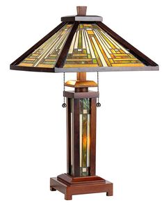 a stained glass lamp on a wooden stand