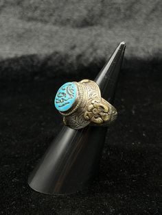 A Beautiful Antique Beautiful Silver Unique Ring With Islamic Writing On Turquoise Stone. Ring Size 9 US. Shipping Payment Feedback & Return Policy 1 : We ship Monday to Friday Via Airmail Register Insured  With Tracking # takes 2 to 4 Weeks to Destination. 2 : Contact us if you did not receive your item after 4 weeks. 3 : We Accept Payment From Most of the Mainstream Payment Methods. 4 : In Any Inconvenience Case we do Accept Return and full Refund. 5 : We Ship worldwide via Airmail Registered Blue Spiritual Open Ring Jewelry, Spiritual Blue Open Ring Jewelry, Handmade Blue Turquoise Wedding Ring, Blue Turquoise Open Ring For Wedding, Blue Bohemian Jewelry With Metal Ring, Bohemian Blue Jewelry With Metal Ring, Handmade Turquoise Ring For Wedding, Traditional Adjustable Turquoise Ring, Traditional Adjustable Turquoise Ring As Gift