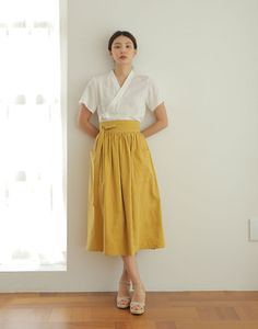 This skirt is a waist skirt with large pockets on both sides.   * 3colors - Mustard & Navyblue & Khaki   * Wrap design waist skirt   * Beautiful Linen design fabric material   * Try match with any other item that you have, they will look great together!   ▶Size    - For the detailed size, please refer to the table in the side menu attached with the picture. ▶Materials  - For more information on the mixing ratio of textiles, please refer to the table in the side menu attached with the picture. ▶M Culotte Skirt, Linen Design, Modern Hanbok, Skirt High Waist, Womens Skirts, Skirt Vintage, Korean Traditional, Vintage Linen, Linen Skirt