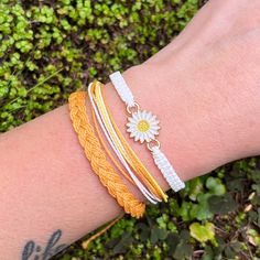 Set of three bracelets from waxed twisted cord in the colours of yellow, white and honey yellow. First model is square knot white bracelet with white flower charm in the middle, second model is made from braided bright yellow, honey yellow and white threads and the third one is honey yellow coloured braid. The bracelets width is about 4-5mm and they fasten with a sliding knot so you can adjust the size to fit perfectly. Minimum diameter of the bracelets when closed is 15-16cm. and the fastening threads allows it to be opened to around 28-30cm. If you need specific size please let us know, custom orders are welcome, feel free to contact us with any questions. All of our bracelets are 100% handmade, we don't sell anything that is not crafted by us. Created with love for you! S Bracelet, Honey Yellow, Sell Anything, White Bracelet, Square Knot, White Bracelets, Sliding Knot, Boho Women, Charm Gift