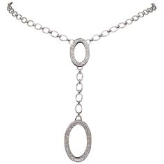 Approximately 1.30CTW diamond oval drop necklace crafted in 18k white gold. Diamond Carat Weight: Approximately 1.30CTW Diamond Cut: Round Brilliant Cut Color: Average G-I Clarity: Average VS Metal: 18K White Gold Approximate Drop Length: 3 3/16” Long Necklace Length: Approximately 17.5" Long Marked/Tested: Stamped "18K" Weight: 17 Grams