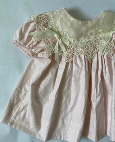 Stunning Vintage 90's Baby Dress - Size 6 months No tag but feels like cotton, lace bib with bows in excellent condition Short Sleeve Cotton Dresses With Lace Work, Cotton Dresses With Lace Work And Short Sleeves, Cotton Baptism Dress With Lace Collar, Cute Cotton Dress With Lace Collar, Cotton Dress With Lace Collar For Baptism, Pink Cotton Dress With Lace Collar, Vintage Baby Dress, Vintage Baby Dresses, Baby Girls Dresses