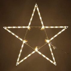 a lighted star hanging from the ceiling