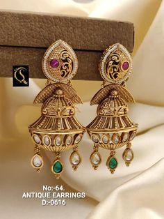 Description :- Indian hoop earrings/Antique gold hoop jhumka /pearl hoops/ Indian Bali earrings/Baali /jhumkis/ pearl earrings/ Pakistani earrings Gift yourself a royal look with this perfectly crafted Juda set from Manalisstudio. Crafted with high quality stones and pearls, it is impressive in design. The green enamel artwork adds perfect texture to the design. Perfect for weddings and festivities, this antique Juda should be put on with your favorite sari or lehenga. 100% Satisfaction. Long La Indian Hoop Earrings, Hoop Jhumka, Pakistani Earrings, Gold Jhumka, Bali Earrings, Earrings Antique, Antique Earrings, Green Enamel, Stencil Designs