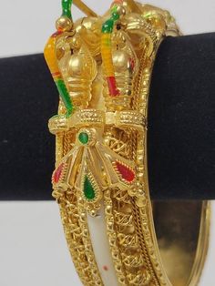 This figural gold and enamel bracelet features stylized fish, possibly koi. Unsigned. See photos of intricate filigree work. Measures 7.5" circumference on the inside.●Our shop is currently liquidating a collection of luxury estate sale handbags, vintage statement jewelry, and handmade one-of-a-kind jewelry. We will gladly provide additional images or information, contact us through this site or our Facebook page.Follow us on Facebook and Instagram @tinglazesandglassThank you for shopping on Ets Antique Gold Enamel Bracelets, Wedding Enamel Bangle Jewelry, Traditional Gold Enamel Bangle, Ceremonial White Bangle With Intricate Design, Ornate Gold Enamel Jewelry, Gold Enamel Wedding Jewelry, Gold Jewelry For Collectors And Festivals, Ornate Gold Bracelets For Festivals, Ceremonial White Bracelets With Intricate Design