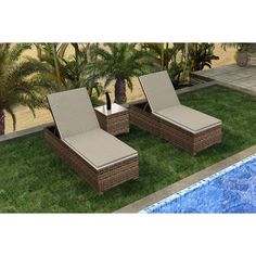 two lounge chairs sitting next to a swimming pool