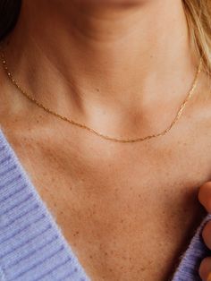 This classic gold chain is a modern basic for every woman. We are in love with this delicate mini 'paperclip' chain that can be worn on its own, layered with other necklaces, or holding your favorite charms and pendants. Our 14k gold chain has delicate, rectangular “paperclip” links which give this chain a cool, modern look! Available in 16”, 18", 20", and 24" - there is a perfect length for just about anyone! Elegant Everyday Charm Necklaces With Paperclip Chain, Dainty 14k Gold Filled Chain Necklace For Everyday, Dainty Charm Necklaces With Paperclip Chain, Dainty Paperclip Chain Link Charm Necklaces, Dainty Cable Chain Necklace For Everyday, Dainty 14k Gold Charm Necklaces With Gold Chain, Dainty Paperclip Chain Link Charm Necklace, Dainty Everyday Chain Necklace, Delicate Paperclip Chain Necklace For Everyday Wear