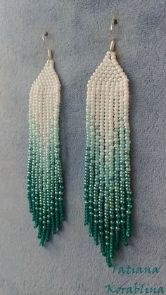 These handmade earrings are made of high-quality Czech beads and strong synthetic thread. They are elegant, fashionable, and highly versatile, suitable for everyday wear. Color: white, green . 100% hand made with love! Measurements: Length-about 11.5cm (4.33 inch) Width -about 2 cm (0.79 inch) Materials: Sterling silver components Czech glass beads Nylon Thread Handmade White Chandelier Earrings With Round Beads, White Long Drop Earrings With Colorful Beads, White Beaded Long Drop Earrings, Handmade Green Beaded Long Drop Earrings, Artisan White Earrings With Beaded Fringe, Green Handwoven Dangle Beaded Earrings, Traditional Green Handwoven Beaded Earrings, Nickel-free Green Beaded Earrings For Beach, Red Chandelier