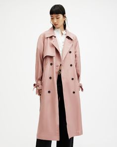 It's time for lightweight layers. Try the Kikki Trench, crafted from a fluid fabric and shaped to an oversized, double breasted silhouette with a self-tie waist belt. Topstitching is the final detail - you'll find it on the cuffs and belt.   This coat is designed to an oversized fit, we recommend sizing down for a closer fit Button closure Collar Long sleeves Double breasted Self-tie belt Two front welt pockets Curved back storm flap Chic Gabardine Outerwear For Daywear, Oversized Chic Outerwear With Belted Cuffs, Chic Oversized Outerwear With Belted Cuffs, Spring Outerwear With Tie Waist In Solid Color, Spring Outerwear With Tie Waist, Spring Gabardine Outerwear For Daywear, Chic Double-breasted Spring Outerwear, Solid Tie Waist Outerwear For Spring, Oversized Outerwear With Belted Cuffs For Spring