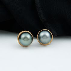 Product Details Vintage Beaded Earring is set with Solitaire Tahitian Pearl stone in the center with vintage beaded design magnify the beauty of piece. This Tahitian Pearl Stud Earring is available in Solid Gold. Product Information SKU SHP-EARRINGS102026329 Weight 2.16 gm (Approximate) TAHITIAN PEARL INFORMATION No.of Stones 2 Pieces Total Weight 16.18 Carat (Approximate) Dimension(approx) Round-8X8 mm-2 Pcs Color Black Cut Brilliant Shape Round Setting Type Bead-Set Quality Grade AAA View More Tahitian Pearl Jewelry With Matching Earrings For Anniversary, Elegant Gold Tahitian Pearl Earrings, Classic Tahitian Pearl Jewelry With Matching Earrings, Classic Tahitian Pearl Earrings For Anniversary, Tahitian Pearl Round Earrings For Wedding, Classic Gold Tahitian Pearl Earrings, Classic Gold Jewelry With Tahitian Pearl, Round Tahitian Pearl Earrings For Wedding, Classic Tahitian Pearl Earrings