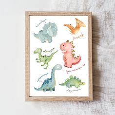 a wooden frame with watercolor dinosaurs on it