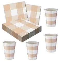 a set of four cups sitting next to each other