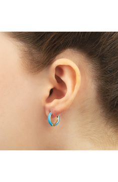 Easy-to-wear hoop earrings will add significant polish to even your most casual ensembles. 1/2" drop; 1/8" width Hinge with snap-post closure Sterling silver with goldtone plate/enamel Imported Blue Hypoallergenic Hoop Jewelry, Hypoallergenic Blue Hoop Jewelry, Blue Hypoallergenic Small Hoop Earrings, Blue Hypoallergenic Hoop Earrings, Blue Hypoallergenic Small Hoop Jewelry, Hypoallergenic Blue Small Hoop Jewelry, Blue Huggie Hoop Earrings For Pierced Ears, Nickel-free Enamel Hoop Earrings, Blue Hoop Huggie Earrings Gift