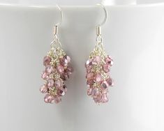 These sparkly pink earrings will help you get ready for a fun time.  Czech 3mm fire polished glass beads in light pink with a metallic coating are wire wrapped individually and joined into a beautiful cascade. The cascade dangles 1.5 inches from your piercing with ear wires of either silver plated surgical steel or sterling silver. More of my jewelry can be found here: https://www.etsy.com/shop/MaryMorrisJewelry You can Follow my activities and showings on Facebook at: https://www.facebook.com/pages/Mary-Morris-Jewelry/138803229490152 MMJ Item #12172/892-h Pink Dangle Earrings With Faceted Beads, Pink Dangle Crystal Earrings With Faceted Beads, Pink Wire Wrapped Earrings For Party, Sterling Silver Pink Dangling Bead Earrings, Party Pink Wire Wrapped Earrings, Pink Sterling Silver Dangling Earrings, Pink Sterling Silver Beaded Drop Earrings, Crystal Dangle Earrings, Pink And Silver