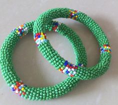 Beaded Bracelets | African Maasai Beaded Bracelets | African Jewelry | Beaded Bangles | Ethnic Bracelets| Gift For Her |A Set Of Two BanglesThese superbly crafted beaded bracelets are made of glass beads.The price is for a set of two bracelets.Main Color - Green.Available in different colors.Feel free to send me a convo or e-mail for any clarification.Thank you for visiting... African Beaded Bracelets, Beaded Bangles, Yellow Necklace, Bead Bangles, Jewelry Beaded, Maasai, African Beads, African Jewelry, Bracelet Gift