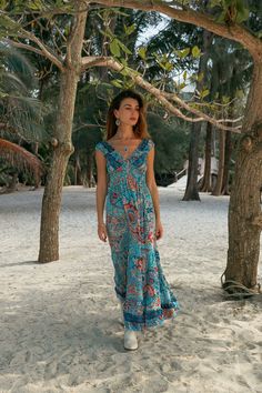 Bohemian Maxi Ruffles Dress, Elasticated Under The Chest For Perfect Fitted Look. This Elegant Flowing Dress is Light and Does Not Wrinkle, It is Made of Polyester. Its Touch is Soft Like Silk But It Is Much Easier to Care. Fluid, Light and Comfortable Fabric with Colorful Prints, Making It  The Ideal Summer Dress For The Beach, a Party or When Traveling. Free Size from s to xl Main Color: Light Blue Printing Color: Blue, Red  100% Polyester Machine wash 30o No Dryer HandMade Delivered In A Clot Bohemian V-neck Sundress With Ruffles, Blue Flowy Hippie Dresses, Sleeveless Blue Maxi Dress With Boho Print, Bohemian Ruffled Sundress For Beach, Bohemian Sleeveless Turquoise Dress, Blue Ruffled Maxi Dress For Beach, Turquoise Sleeveless Bohemian Dress, Blue Printed Hippie Dresses, Blue Hippie Printed Dresses