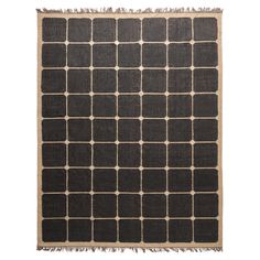 a black and beige rug with squares on it