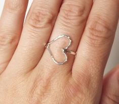 So sweet, this hammered sterling sideways heart ring is perfect for every day. Just love the shape and delicate beauty. :) Choose from all sterling or a gold filled band with a silver heart! Please view the other rings at: http://www.etsy.com/shop/BellatrinaJewelry?section_id=11006644 Please choose from sizes 5-10 and leave message in comment box at checkout. Can be made in gold filled too (as seen in second to last photo)! ** Follow us for updates, contests, and promos. :) IG @bellatrinajewelry Fashion Highlights, Silver Heart Ring, Ring Heart, Gold Filled Ring, Hammered Gold, White Gold Jewelry, Love Ring, Ring Silver, Metal Stamping