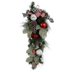 a christmas wreath with pine cones and ornaments hanging from it's side, on a white background