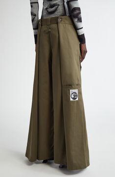 The maison's penchant for unconventional silhouettes is emphasized in the layered design of wide-leg pants that create a four-leg wrapped illusion. 30" inseam; 28" leg opening; 15 1/2" front rise; 17 1/2" back rise (size Medium) Zip fly with hook-and-bar closure Front welt pockets 65% polyester, 35% cotton Machine wash, dry flat Made in Portugal Designer Clothing Luxury Relaxed Fit Wide Leg Pants For Men, Affordable Versatile Wide Leg Pants With Pockets, Affordable Wide Leg Pants With Side Pockets, Besh Pants, Free Size Trousers, Unique Pants Cotton, Pland Pants, Tailor Pants Waist, Wide Leged Pants