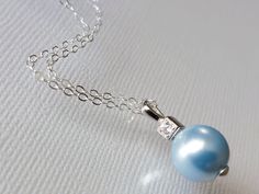 Wedding Light Blue Blush Blue Pearl Drop .925 Sterling Silver CZ Bridal Pendant Necklace with .925 Sterling Silver Chain. PLEASE READ ITEM DESCRIPTION and SHOP POLICIES before placing your order, and contact me with any questions! CHAIN is 18 inches (45.7cm) long. PENDANT is about 0.70 inch (1.8cm) long including bail. BRIDAL NECKLACES SECTION: https://www.etsy.com/shop/LanaChayka?ref=seller-platform-mcnav§ion_id=11638944 JEWELRY SETS SECTION: https://www.etsy.com/shop/LanaChayka?ref=seller-plat Elegant Light Blue Necklace For Anniversary, Elegant Light Blue Necklaces For Gifts, Elegant Light Blue Necklace For Wedding, Elegant Light Blue Wedding Necklaces, Elegant Blue Bridal Necklace, Blue Pearl Pendant Jewelry For Wedding, Elegant Blue Necklace With Pearl Pendant, Formal Blue Necklace With Pearl Pendant, Blue Sterling Silver Jewelry For Bridesmaid Gift