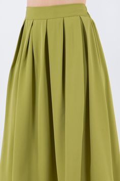 Vintage vibes with our box pleats midi skirts. Wear yours with a graphic t-shirt and sneakers, or dress it up with a fitted top and heels. Make it your own style for any occasion. Fit is true to size. Waistband has back elastic for stretch. Fabric: 100% polyester. Green Skirt With Pleated Hem For Spring, Spring Solid Pleated Skirt With Pleated Hem, Spring Green Stretch Pleated Skirt, Green Pleated Hem Skirt For Summer, Green Stretch Pleated Skirt For Spring, Green Summer Skirt With Pleated Hem, Chic Green Flowy Pleated Skirt, Casual A-line Pleated Skirt With Accordion Pleats, Casual A-line Accordion Pleated Skirt