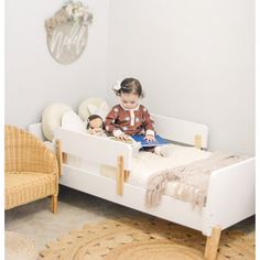 "A sturdy bed built just for toddlers with playful curves and modern shapes to smooth the meaningful transition into “a real bed.” The low profile and two removable rails provide a safe and comfortable sleeping place that helps your active toddler easily get in and out of bed. This high-quality bed fits a standard crib mattress and brightens any decor with a pop of modern design. " dadada Bed Frame Color: White/Natural | dadada Muse 19.49 H x 31.0 W x 55.0 D in white / brown in White / Natural | Modern Toddler Bed, Nursing Pillows, Toddler Beds, Modern Shapes, High Quality Bedding, Crib Mattress, Grey Bedding, Toddler Room, Baby Safe