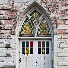 an old church door with stained glass windows