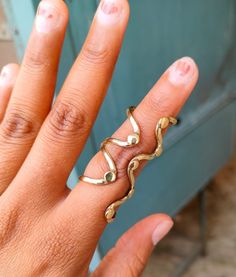 Unique Metal Toe Ring Jewelry, Unique Gold Midi Rings With Open Band, Unique Gold Open Band Midi Rings, Artistic Metal Rings With Unique Design, Artistic Open Ring In Metal, Artistic Metal Open Ring, Metal Toe Ring For Jewelry Making, Adjustable Gold Toe Bypass Ring, Artsy Gold Jewelry With Unique Design