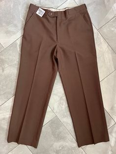 "Vintage dad-pant trousers made by Boulevard Club. Lovely neutral brown colour. 100% wool. Tag does not indicate size, measures 16\" across waist, 20\" hips, 11\" rise, 28\" inseam, 9.5\" leg opening." Tailored Brown Bottoms With Tapered Leg, Brown Tailored Tapered Leg Bottoms, Tailored Brown Tapered Leg Pants, Brown Tapered Leg Business Casual Bottoms, Brown Tapered Leg Bottoms For Business Casual, Brown Full Length Dress Pants For Work, Tailored Brown Business Bottoms, Tailored Brown Bottoms For Business, Tailored Brown Pants For Business Casual