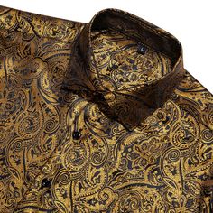 Add a touch of luxury to your wardrobe with the Black and Gold Paisley Silk Short Sleeve Shirt. Expertly crafted from premium silk, this shirt offers an exceptionally smooth and comfortable feel, making it perfect for any sophisticated occasion. The elegant black fabric is beautifully enhanced by a stunning gold paisley pattern, creating a striking visual contrast that exudes opulence and style. Perfect for upscale casual events, summer gatherings, or evening outings, this short sleeve shirt sea Christmas Dances, Gold Paisley, Suit Shirt, Summer Gathering, Musical Band, Fathers Day Sale, Tuxedo Jacket, Mens Short Sleeve Shirt, Silk Shorts