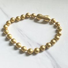 Our large ball chain adds texture to any stack, gold plated and e-coated for protection from tarnish. Measures 7.5” long. Choose between matte gold or aged silver Ball Chain Bracelet, Gold Ball Chain, Vintage Pendant Necklace, Sterling Necklace, Heart Vintage, Vintage Jewelry Crafts, Crystal Choker Necklace, Coin Pendant Necklace, Necklace Layering