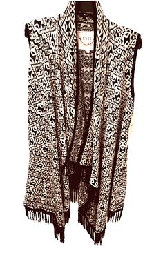 Women's Knit Fringe Vest by Boundless North (BNCI) Company New with Tags Free shipping Size XS or  L - to wear open  Large will fit xl too Large measures:16" shoulder to shoulder 41" to the very longest point with fringe Free Shipping Cream and black Fringe  Flowy vest / wrap Free Shipping to lower 48 states only and local pickup available Our warehouse is full with all of your ski and sport needs Check out our ebay store Returns excepted : Buyer must pay return shipping fees and 10% restocking Black Jacquard Knit Cardigan, Black Bohemian Sweater For Layering, Black Bohemian Knit Cardigan, Black Bohemian Knit Outerwear, Bohemian Black Knit Outerwear, Black Bohemian Cotton Cardigan, Knit Fringe, Fringe Vest, Sweater Cream