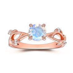 a rose gold ring with an oval blue topazte surrounded by white diamond accents