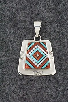 This beautiful turquoise, onyx, mother of pearl, coral and sterling silver inlay pendant and ring ring set was made by Zuni silversmith Vernon Vacit. The set is signed V. Vacit.Pendant Length: 1 1/2"Pendant Width: 1"Ring:Size: 9.5Length: 1 1/8"Width: 1/2"Free shipping on all orders! We ship with USPS and always include tracking. All orders ship within a day of payment.Returns are accepted up to 30 days after you receive your order. Just send us a message. Our shop offers cash back or store credi Artisan Red Jewelry With Inlay, Artisan Red Inlay Jewelry, Red Sterling Silver Jewelry With Inlay, Southwestern Silver Jewelry With Inlay, Southwestern Style Jewelry With Polished Finish For Anniversary, Southwestern Style Polished Jewelry For Anniversary, Traditional Sterling Silver Rings With Inlay, Collectible Sterling Silver Square Pendant Jewelry, Collectible Sterling Silver Jewelry With Square Pendant