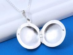 "Solid Sterling silver Locket Necklace. This piece will be a treasured keepsake! A favorite fashion accessory for everybody. They're not only a trendy, stylish accessory, but also boast a rich and fascinating history. ! The locket has a little bit of rim to hold 2 pictures in place without any glue! . Take a look at other Locket designs: http://etsy.me/XKqYt8 . Browse through this store http://www.MonyArt.Etsy.com . Need initials, symbolic charms, etc,? http://etsy.me/UFmfXa FEATURE: . Locket Hi Mother's Day Silver Locket Jewelry, Silver Locket Jewelry For Mother's Day, Mother's Day Sterling Silver Round Pendant Locket Necklace, Mother's Day Sterling Silver Round Locket Necklace, Mother's Day Sterling Silver Locket Necklace, Sterling Silver Round Locket Necklace For Mother's Day, Mother's Day Round Sterling Silver Locket Necklace, Round Sterling Silver Locket Necklace For Mother's Day, Locket Necklace For Mother's Day