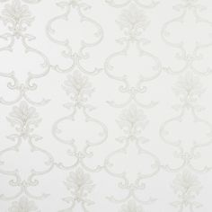 a white wallpaper with an intricate design on it's side and the corner of the wall