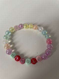 very cute colourful bracelet made with 8mm beads, custom name available with silver letters. a variety of size bracelets available. Please note the colour of the letter beads will be picked at random If you require a different size bracelet please leave a note after purchase. You can also request the bracelet without a name, this will then just be made with a mixture of coloured beads. Please leave a note to advise what name/word/no name is required. Colourful Bracelet, Yo Dream, Colorful Bead Bracelets, Bracelet Cute, 8mm Beads, Silver Bow, Bracelet Ideas, Letter Beads, Cute Necklace