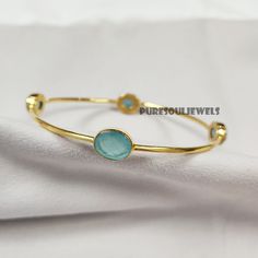 Aqua Chalcedony Bangle, 925 Silver Gold Plated Bangle, Gemstone Bangle, Friendship Bangle, Vintage Bangle, Bangle Bracelet, Designer Bangle Handmade item Gemstone: Aqua Chalcedony Materials: 925 Sterling Silver Finish: Gold Theme- Love & Friendship Style- Boho & Hippie Bangle Size-2.8X2.7 Inches Approx. Ready To Ship You can also have a look on our other amazing similar products here- >Blue Topaz Bangle- https://www.etsy.com/in-en/listing/1248466752/natural-blue-topaz-bangle-925-silver?click_key=4bc8f46c621d72ab25ab2e2efeeca74fecb3f791%3A1248466752&click_sum=1a79a935&ref=shop_home_active_20&pro=1&frs=1 >White Moonstone Bangle- https://www.etsy.com/in-en/listing/1262386807/white-moonstone-bangle-women-bangle-925?click_key=4d9f7b1ac7ee38f5c2b7fde576cac044956dc92b%3A1262386807&click_sum=eaa1a Fine Jewelry Bracelets With Stones, Adjustable Fine Jewelry Bracelets With Stones, Adjustable Round Cuff Bracelet Fine Jewelry, Turquoise Fine Jewelry Bracelets For Gift, Fine Jewelry Bracelets With Stones As Gift, Fine Jewelry Bracelets With Stones For Gift, Sterling Silver Bangle Bracelet With Natural Stones, Bangle Jewelry With Stones As Gift, Elegant Round Turquoise Bracelet