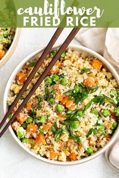 two bowls filled with rice and vegetables next to chopsticks on a white surface