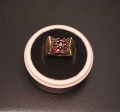 This vintage 1970s ring features a striking garnet cluster in a daisy design, set in a unique recessed setting a modern take on the original daisy cluster. Crafted from solid silver with 9ct gold accents, the ring showcases both elegance and craftsmanship. Hallmarked in Birmingham in 1976 by R J Crafts, it represents the distinctive style of the era. The combination of rich garnets and precious metals makes this a timeless piece, perfect for collectors or anyone who appreciates vintage jewellery Vintage Garnet Cluster Ring As Gift, Vintage Garnet Cluster Ring, J Craft, Daisy Design, Daisy Ring, Design Set, Vintage Ring, Etsy Crafts, Vintage Jewellery