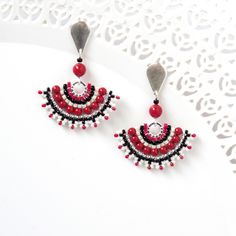 "I created this black red earring by hand, using Swarovski pearls 3mm, Miyuki round seed beads, Miyuki Delica beads and 14k goldfilled push back Closure Stunning, unique and ethnic * Measurements: Earring length: 1.57\" (4cm) Fan element diameter: 1.18\" (3cm) * The earrings will come beautifully packaged for a gift. * For other dangle earrings: https://www.etsy.com/shop/LioraBJewelry/items?section_id=16311270 * my shop: https://www.etsy.com/shop/LioraBJewelry * Shop Policies: https://www.etsy.c Red And Black Beaded Drop Earrings, Red Drop Earrings With Black Beads, Elegant Red Earrings With Black Beads, Red Dangle Jewelry With Bead Caps, Red Jewelry With Bead Caps, Red Earrings With Black Beads As Gift, Red Earrings With Black Beads For Gift, Gift Red Beaded Earrings With Bead Caps, Long Chain Earrings Gold