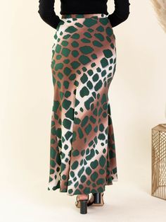 A side zip maxi skirt allows for an easy and carefree way to style any look to instantly dress up and add a stylish flair to your look. A bold animal print inspired look is featured throughout the sweeping long length of this skirt silhouette. Add a pop of color + print into your everyday fall look with this new arrival. 100% Polyester Measures approx. 42" from a S. Model is wearing a S. Multicolor Flared Maxi Skirt For Fall, Multicolor Lined Maxi Skirt For Fall, Fall Multicolor Lined Maxi Skirt, Leopard Print Long Skirt For Spring, Long Leopard Print Skirt For Spring, Relaxed Multicolor Maxi Skirt For Fall, Multicolor Maxi Skirt For Fall With Relaxed Fit, Fall Multicolor Relaxed Maxi Skirt, Leopard Print Flowy Long Skirt