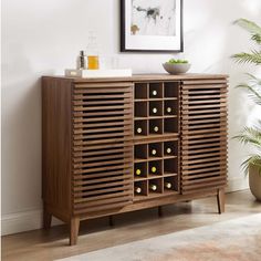 a wooden cabinet with wine bottles in it