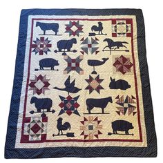 a quilt with farm animals on it and stars in the middle, as well as an american flag