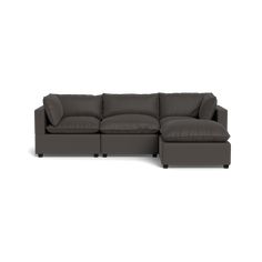 a large sectional couch sitting on top of a white floor